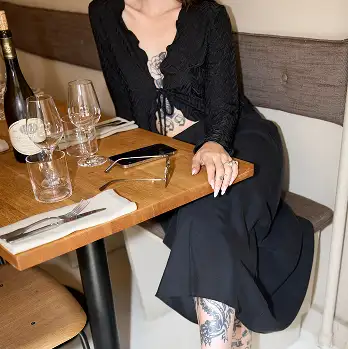 Bellano Bluose on model in restaurant Handmade Danish Women’s Clothing